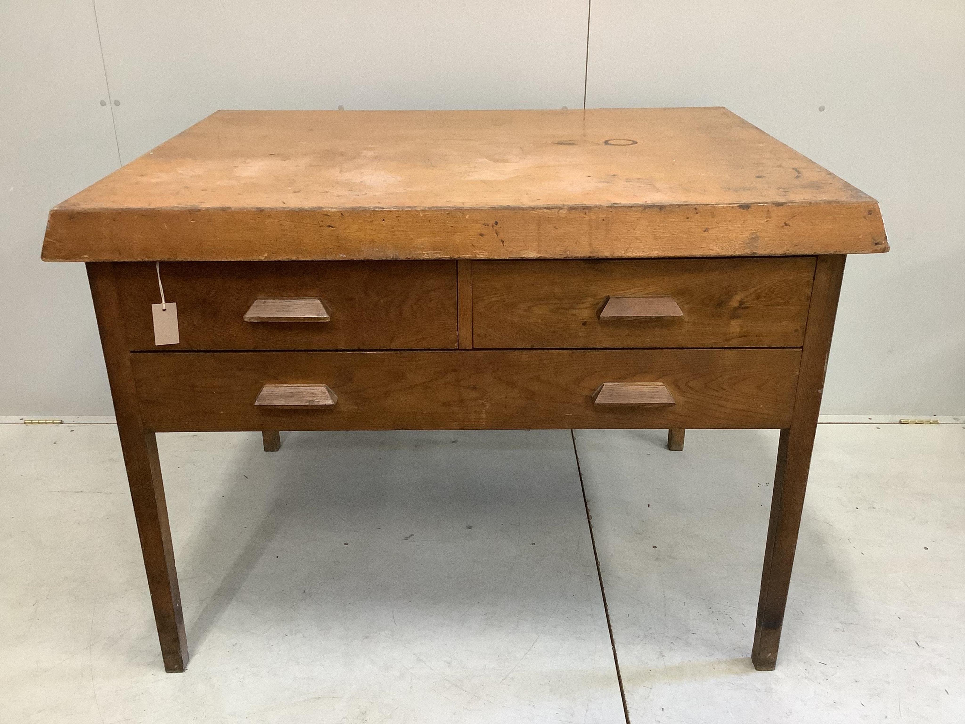 An early 20th century Scandinavian oak three drawer plan chest, width 125cm, depth 94cm, height 92cm. Condition - fair